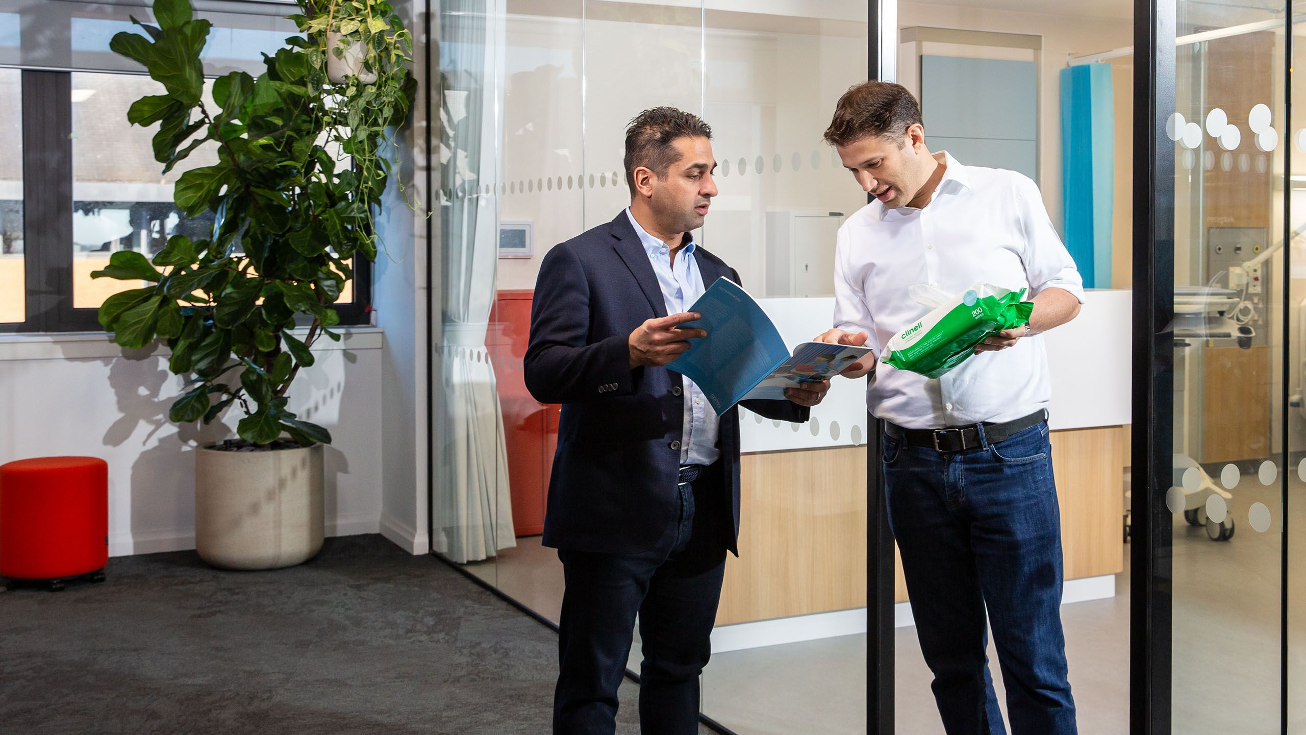 Guy & Allen discussing product brochure